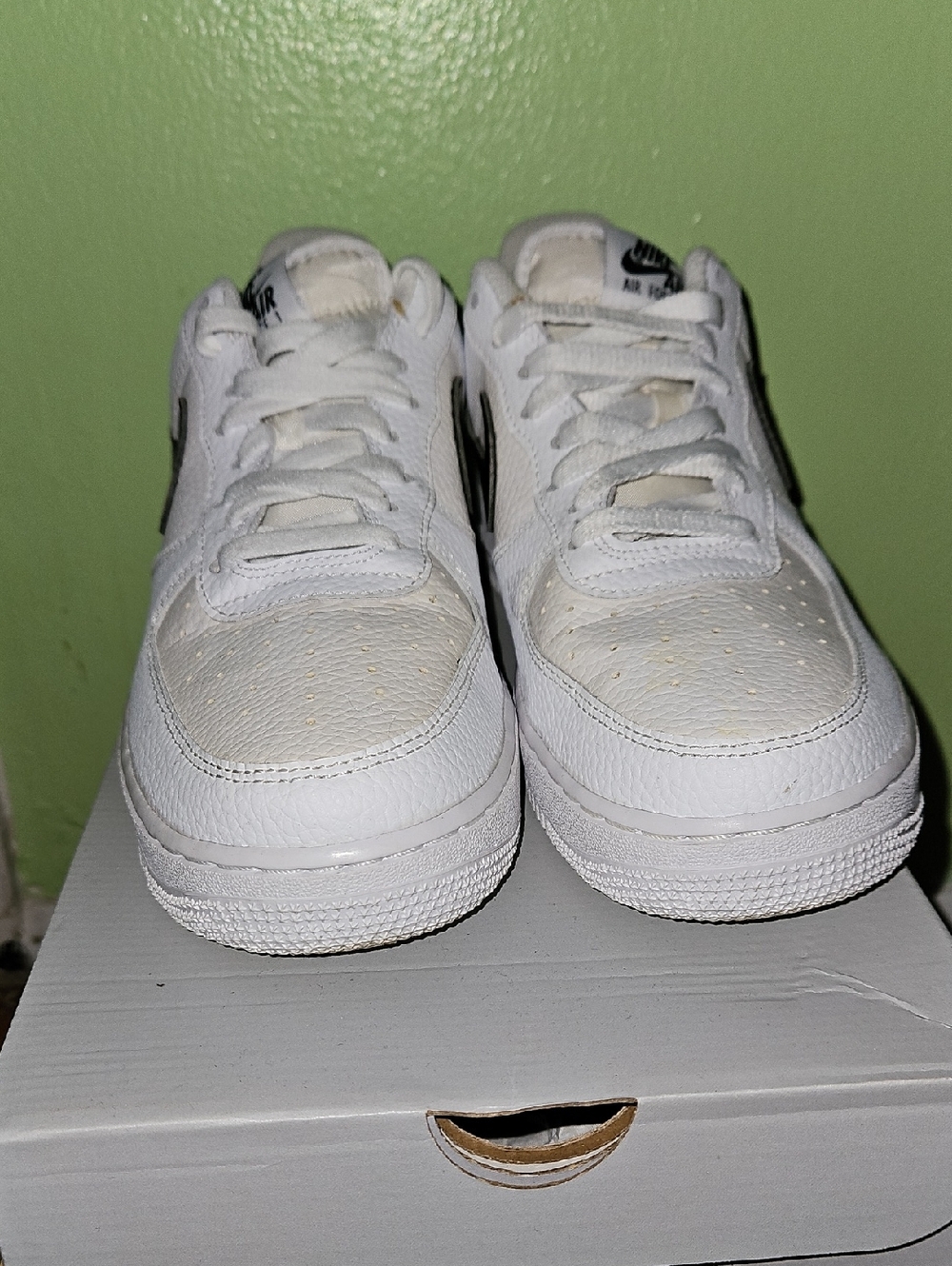 Nike White Low-Top Sneakers with Black Swoosh